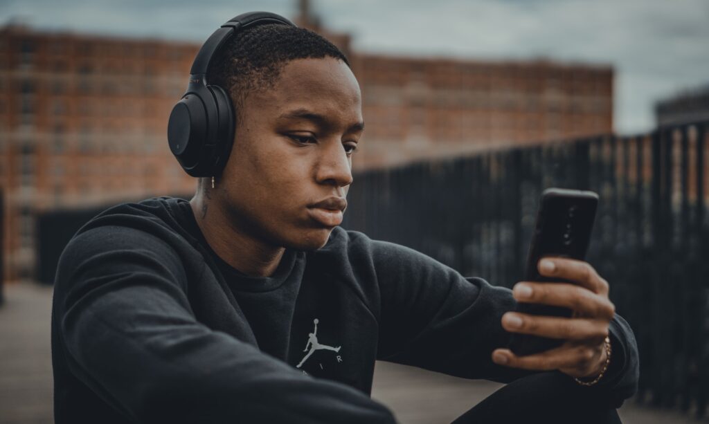 man listening to a podcast