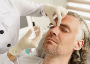 A man receives hyaluronic acid injections