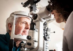 an older man gets a consultation about light adjustable lenses